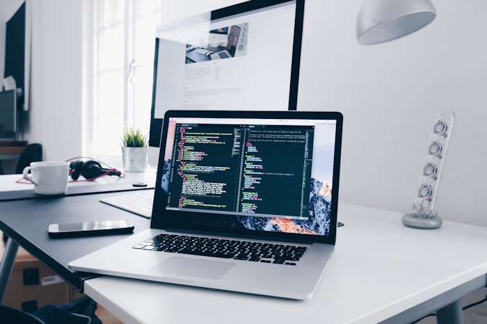 Developer working on a laptop in a modern workspace